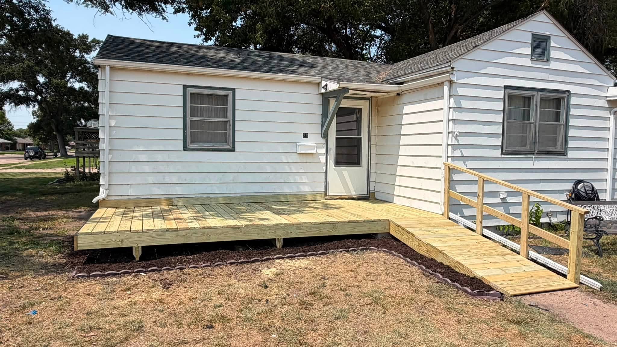 Completed entry deck and accessible ramp