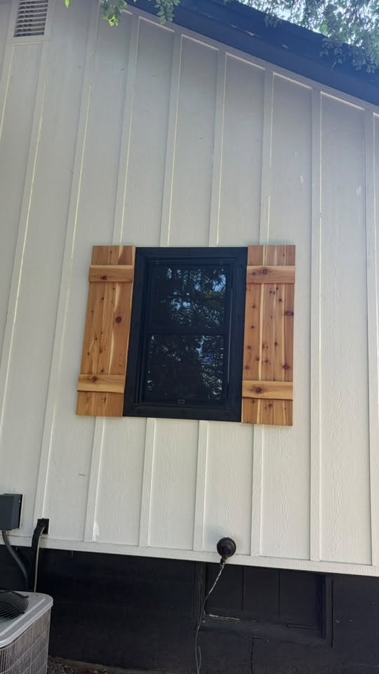 Close view of completed exterior wood shutters
